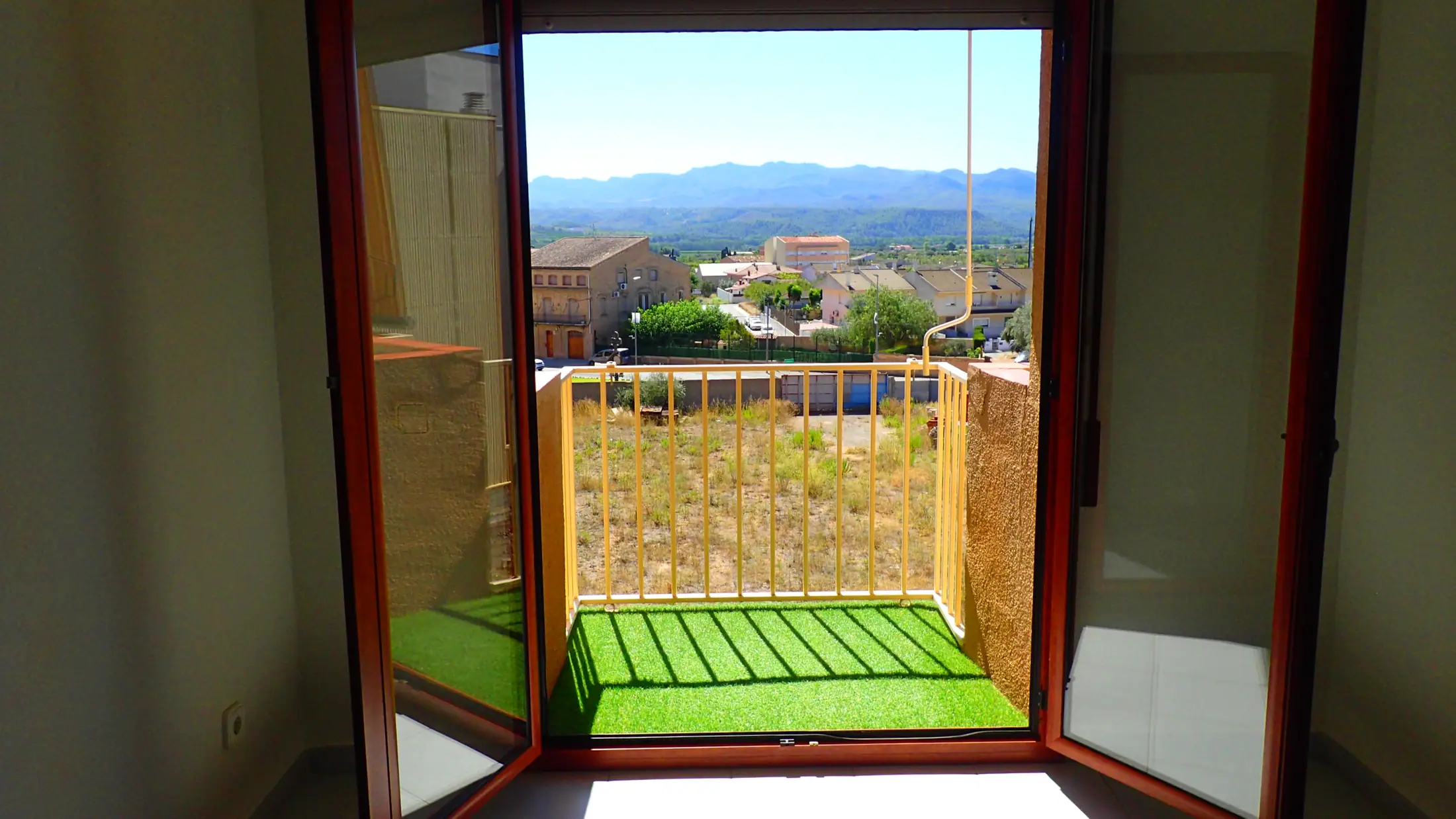 Private balcony with artificial grass and a view to the mountains